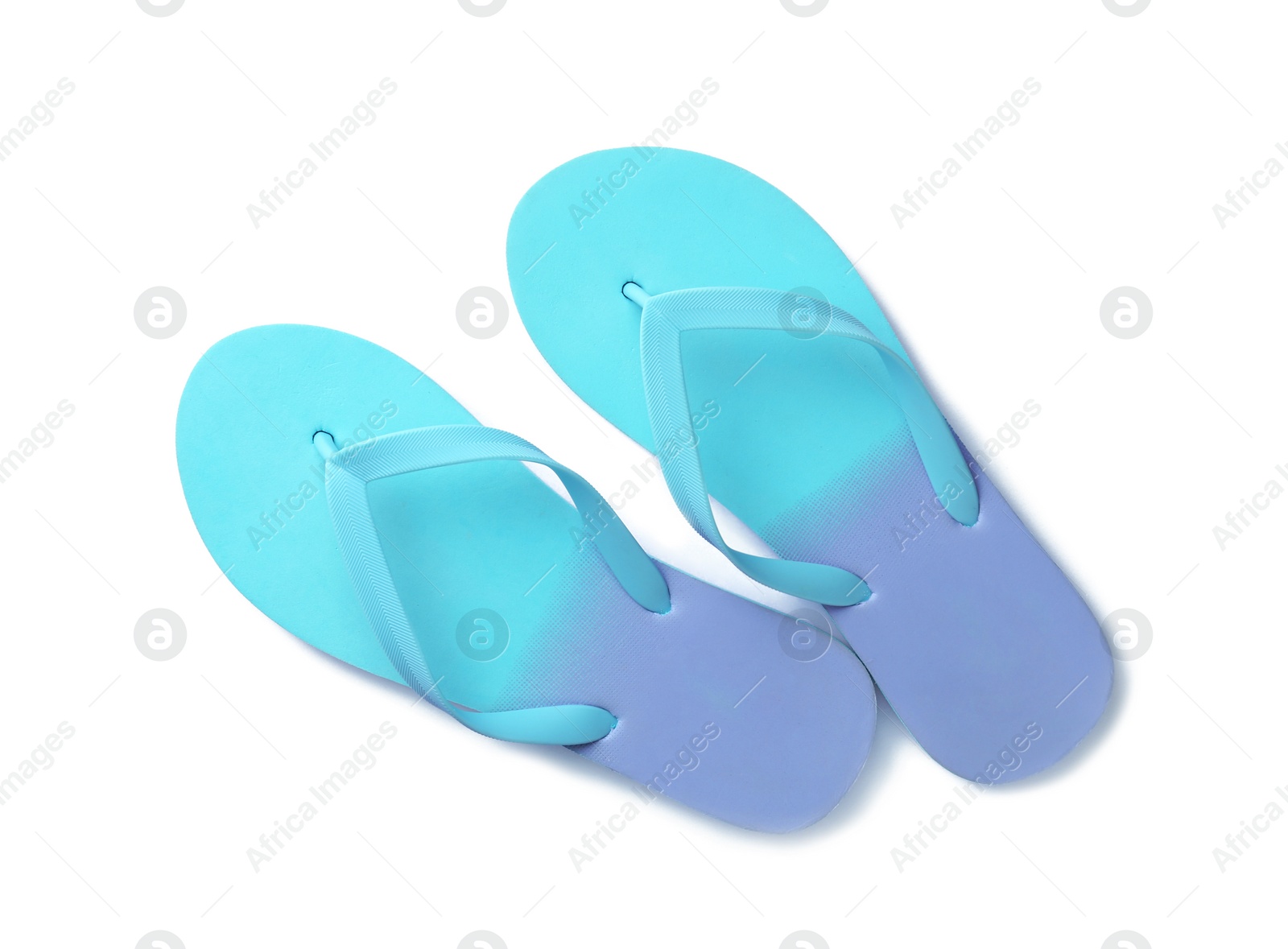 Photo of Bright flip flops on white background, top view. Beach accessories