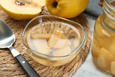 Delicious quince drink and fresh fruits on table, closeup