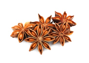 Photo of Dry anise stars with seeds on white background