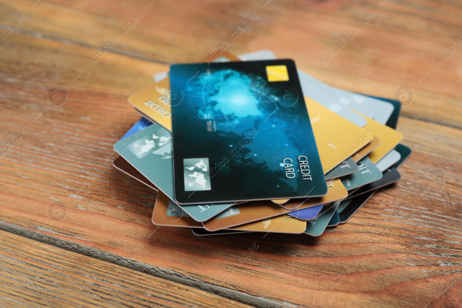 Photo of Many different credit cards on wooden table