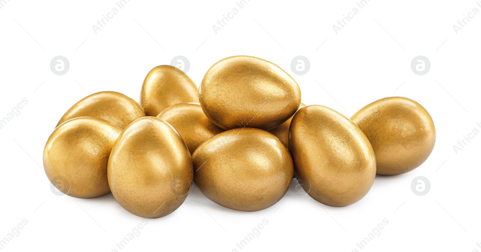 Photo of Many shiny golden eggs on white background