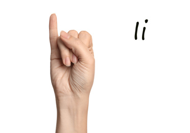 Woman showing letter I on white background, closeup. Sign language