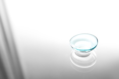 Contact lens on glass background