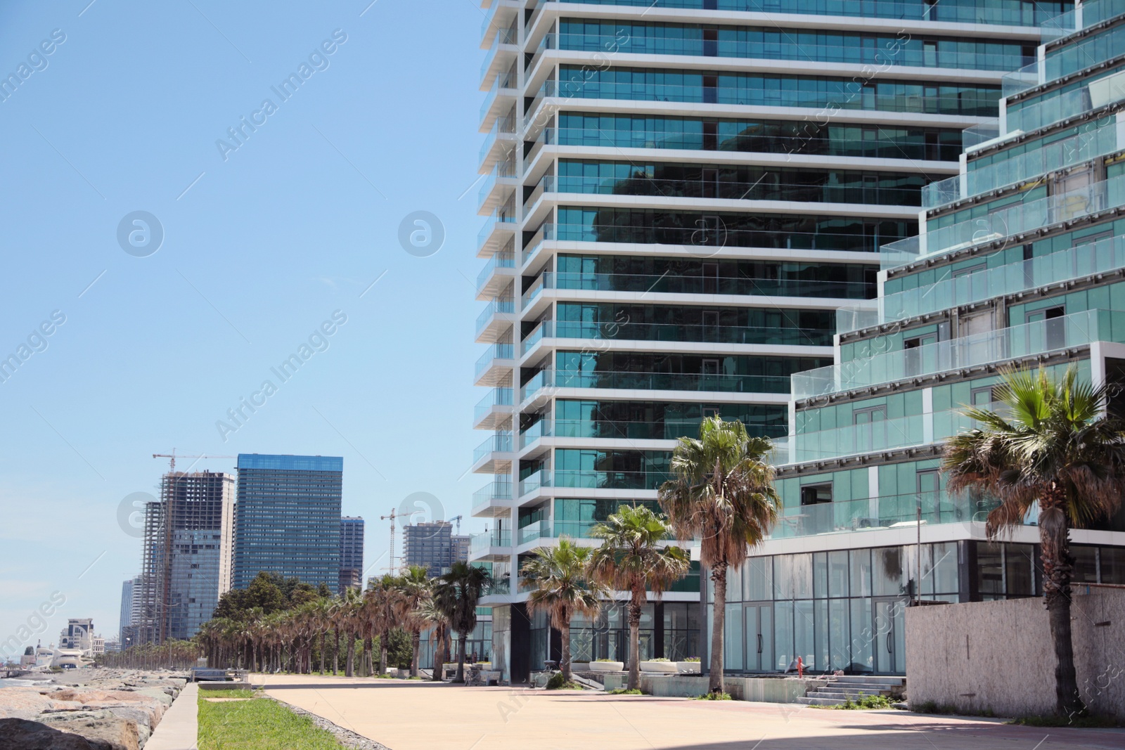 Photo of Cityscape with modern buildings and palm trees