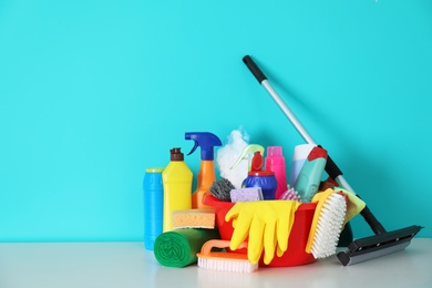 Photo of Set of cleaning supplies on table indoors