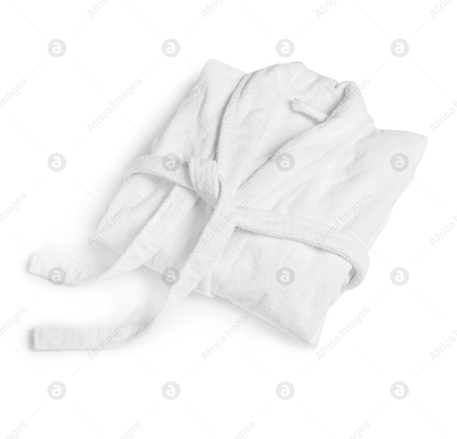 Photo of Clean folded cotton bathrobe on white background