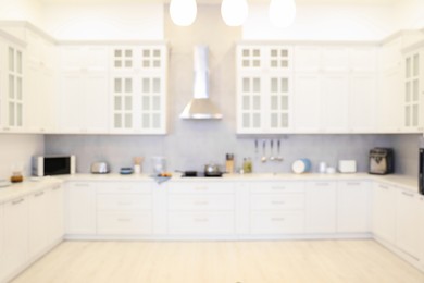 Photo of Blurred view of modern kitchen. Interior design