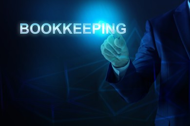 Image of Bookkeeping concept. Businessman pointing at word on dark blue background, closeup