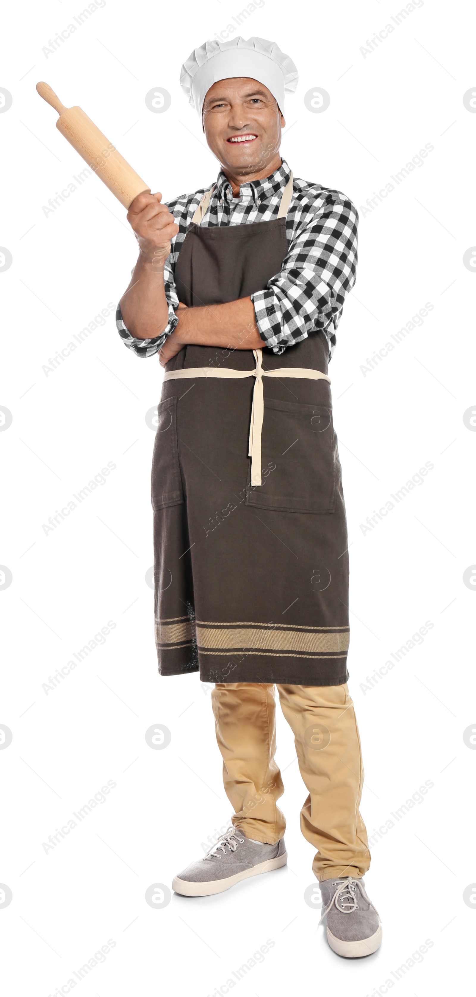 Photo of Mature male chef holding rolling pin on white background