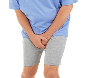 Photo of Mature man with urological problems suffering from pain on white background