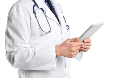 Male doctor holding modern tablet on white background, closeup