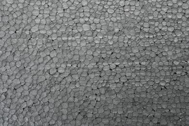 Texture of grey styrofoam sheet as background, closeup