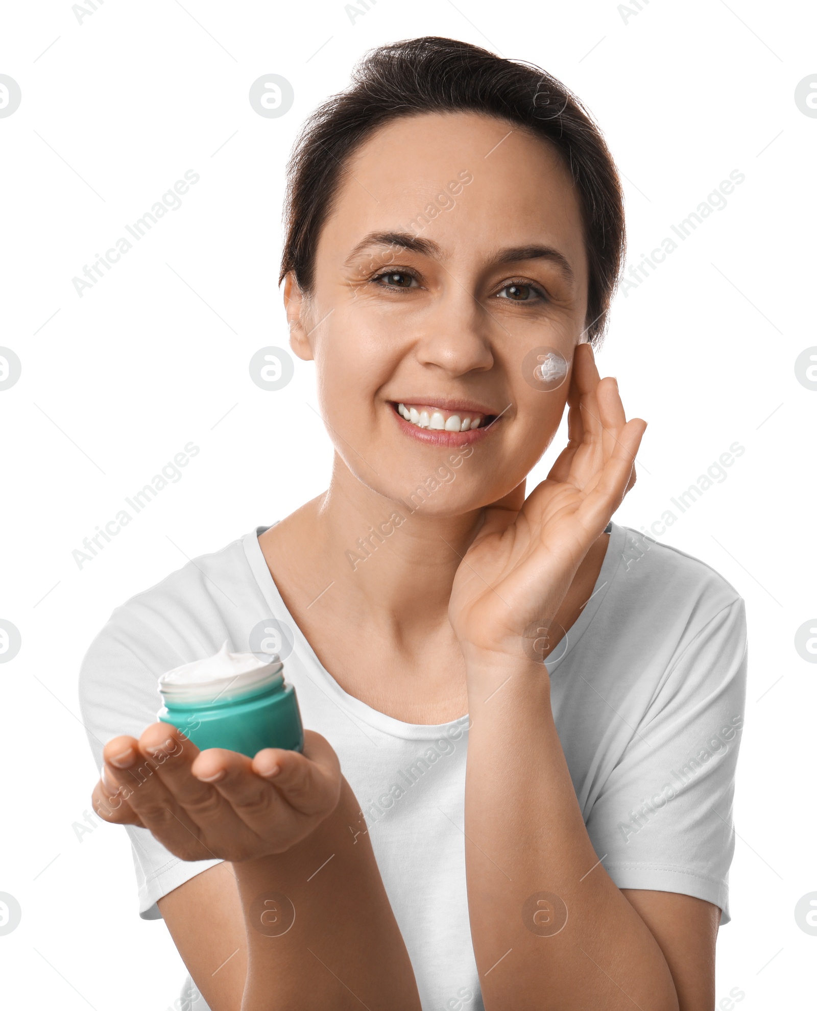 Photo of Woman applying facial cream on white background