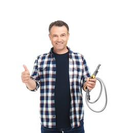 Photo of Mature plumber with hose and adjustable wrench on white background