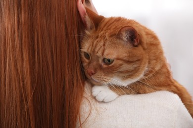 Woman with her cute cat, closeup view