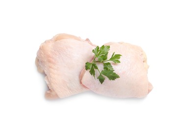 Photo of Raw chicken thighs with parsley on white background, top view