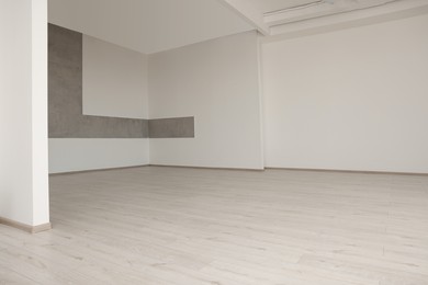 Photo of Empty renovated room with clean light walls
