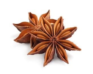 Dry anise stars with seeds on white background