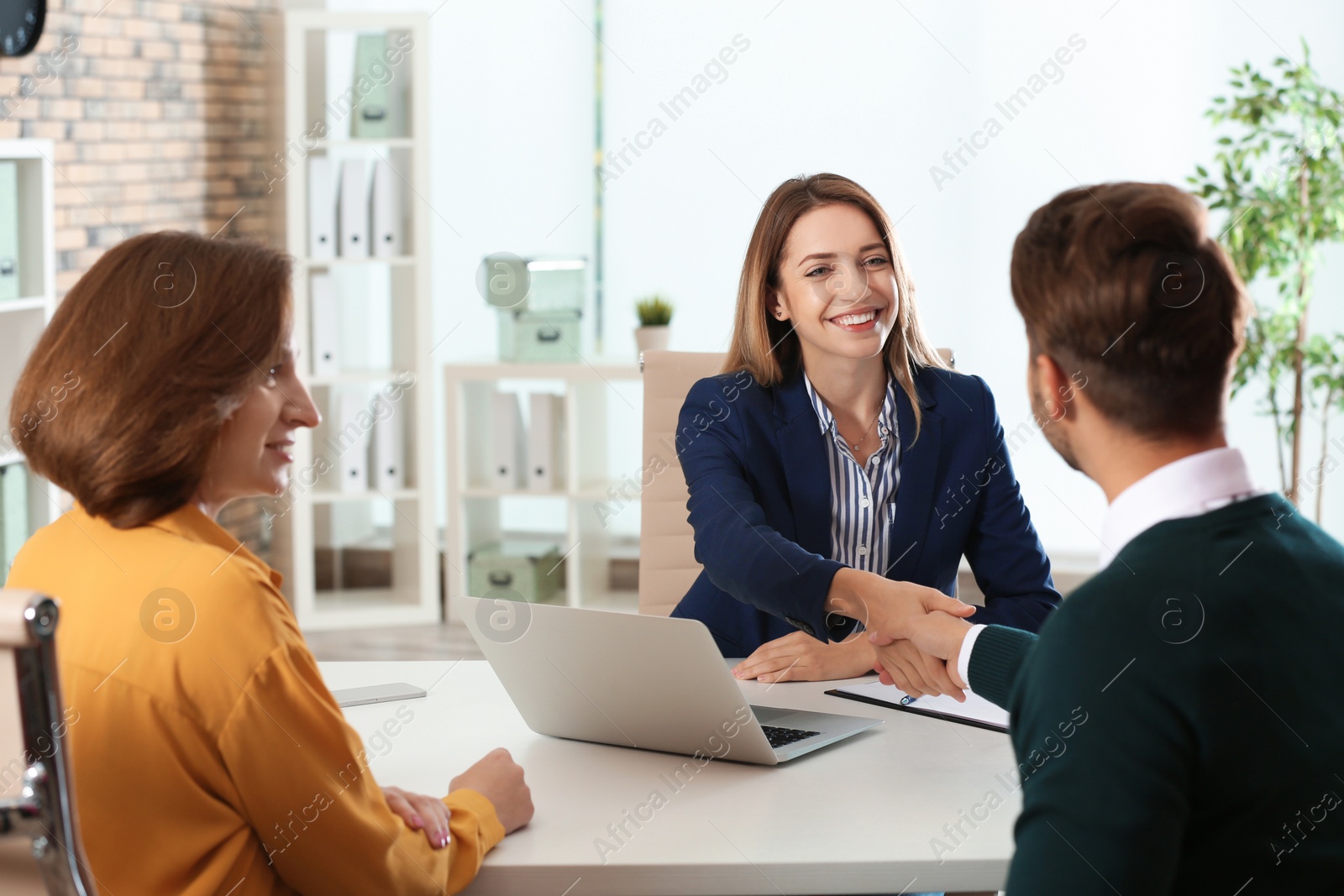 Photo of Human resources manager conducting job interview with applicants in office