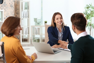 Photo of Human resources manager conducting job interview with applicants in office