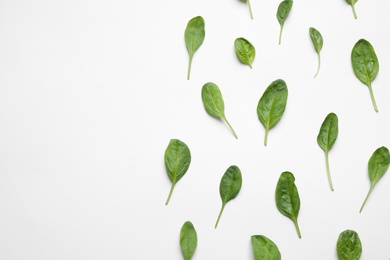 Photo of Fresh green healthy spinach on white background, top view