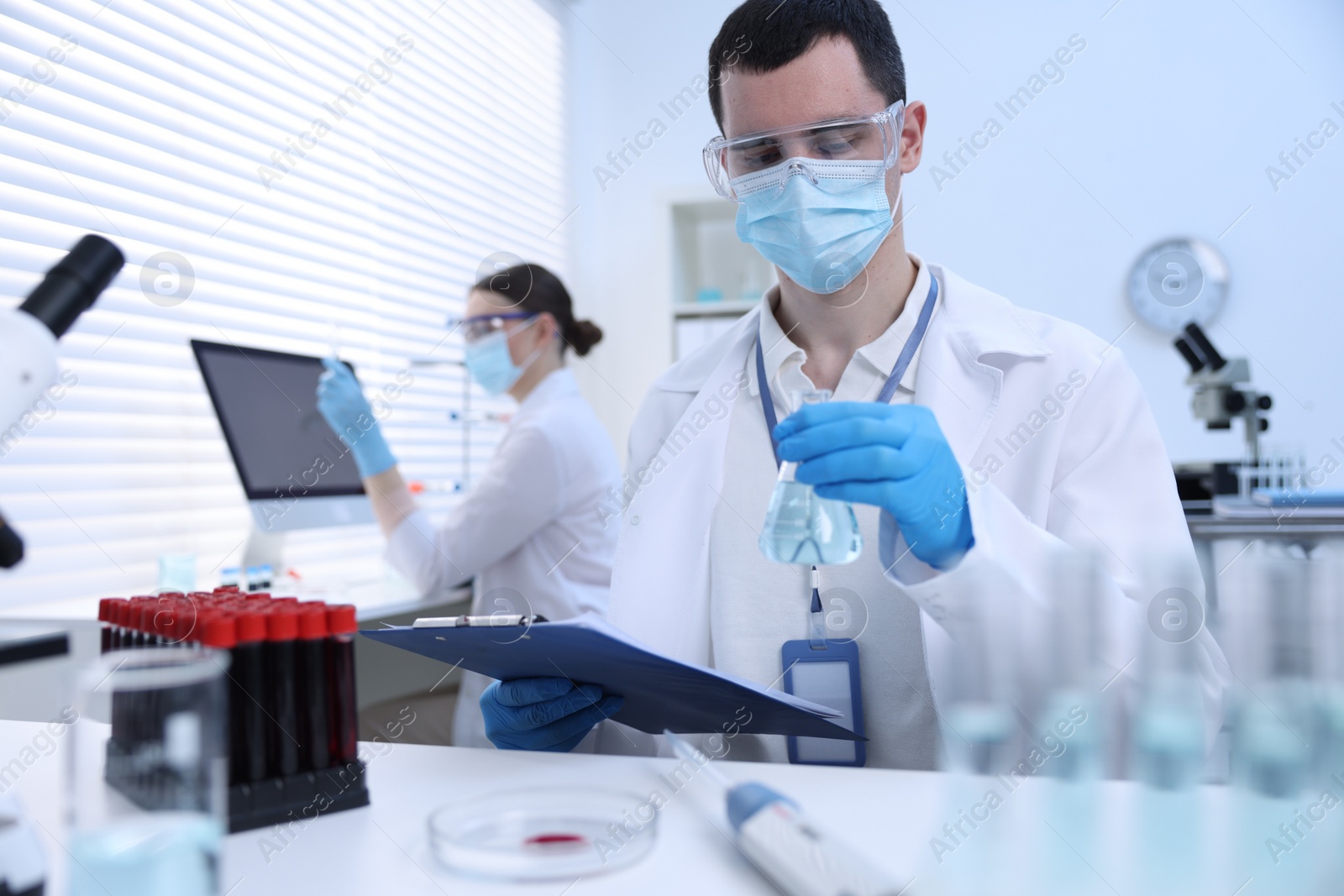 Photo of Scientists working with samples in laboratory. Medical research