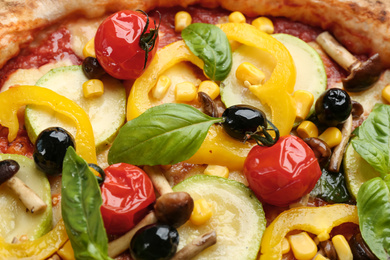 Photo of Delicious fresh vegetable pizza as background, closeup