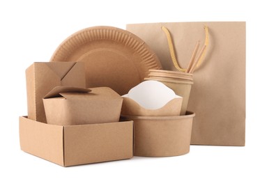 Photo of Eco friendly food packagings, disposable plate and paper bag isolated on white