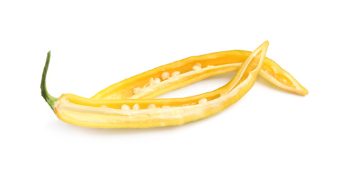 Photo of Halves of ripe yellow hot chili pepper isolated on white