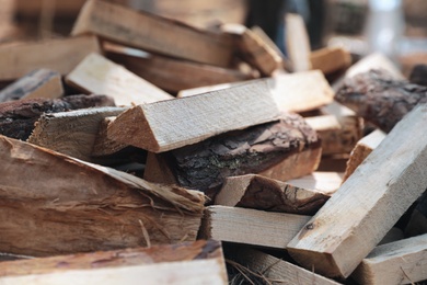 Photo of Pile of cut firewood, closeup. Heating in winter