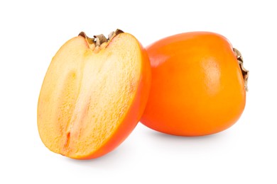 Whole and cut persimmon fruits isolated on white