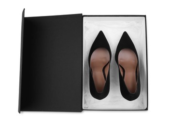 Photo of Pair of stylish leather shoes in black box on white background, top view
