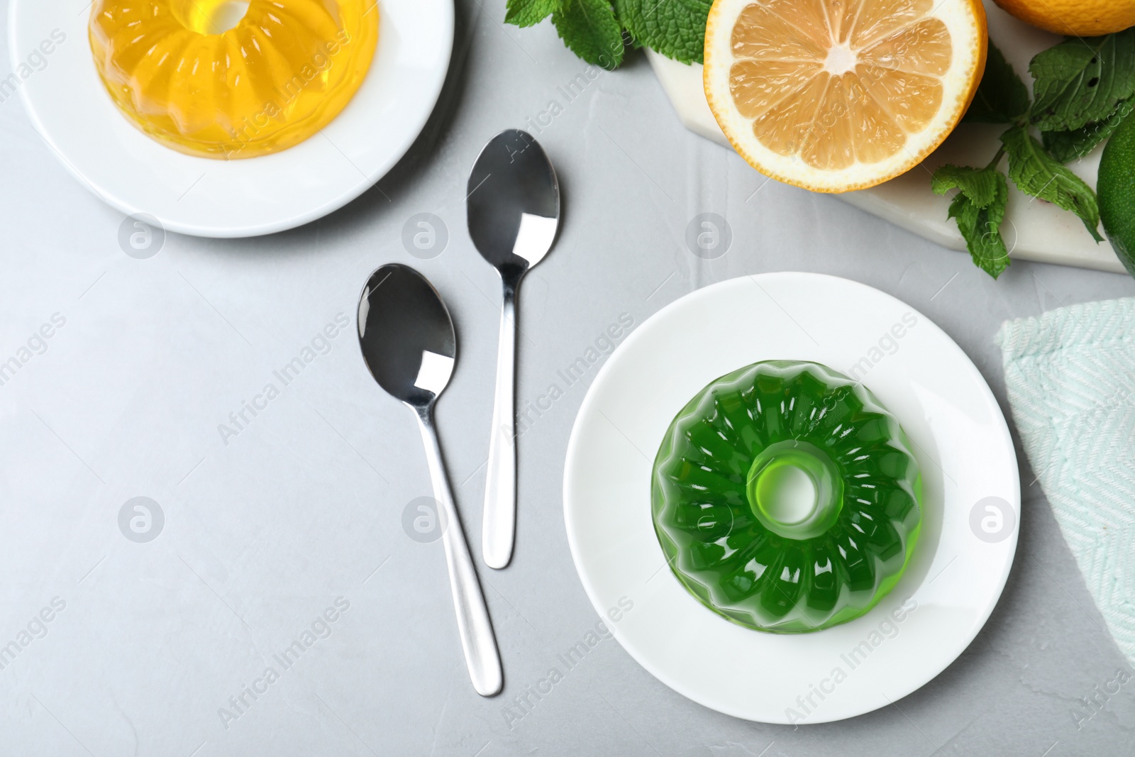 Photo of Flat lay composition with fruit jelly on light grey table