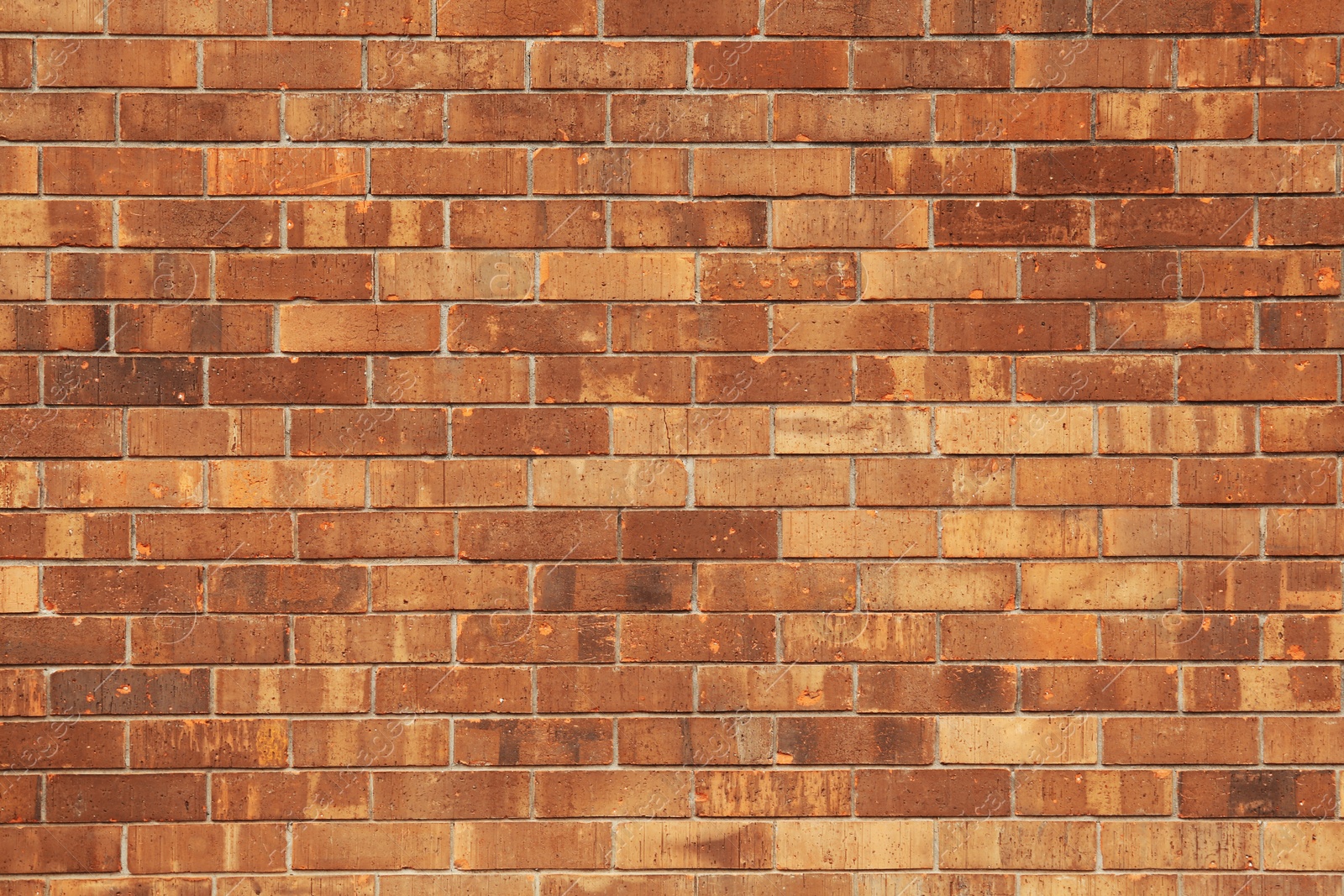 Photo of Texture of brown brick wall as background