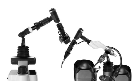 Modern electronic laboratory robot manipulators on white background. Machine learning