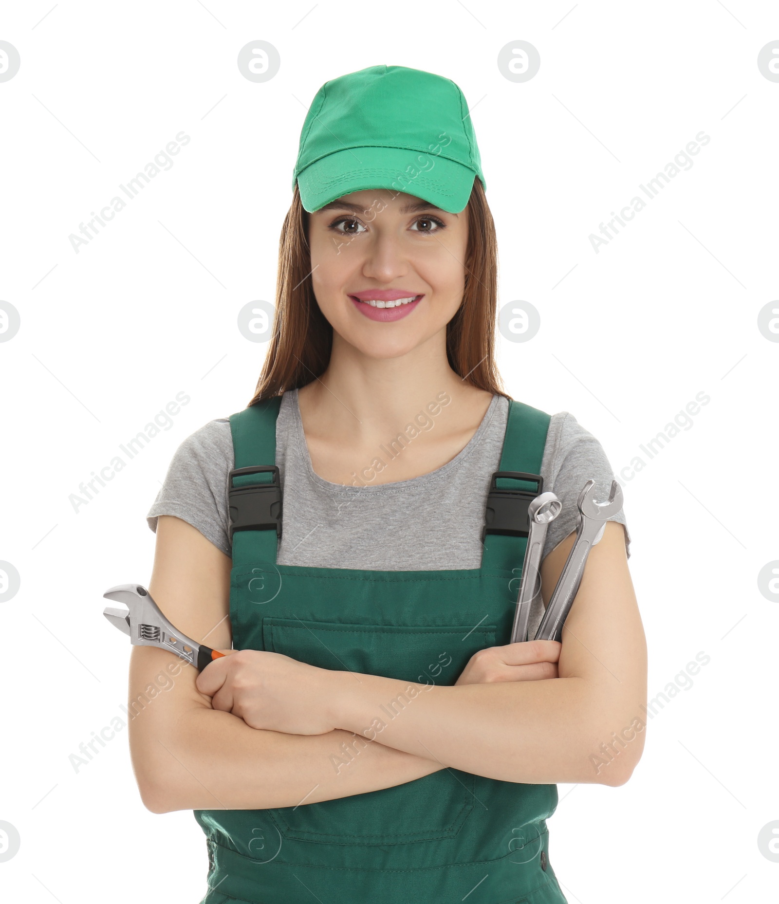 Photo of Portrait of professional auto mechanic with wrenches on white background