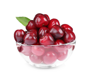 Photo of Tasty ripe red cherries in glass bowl isolated on white