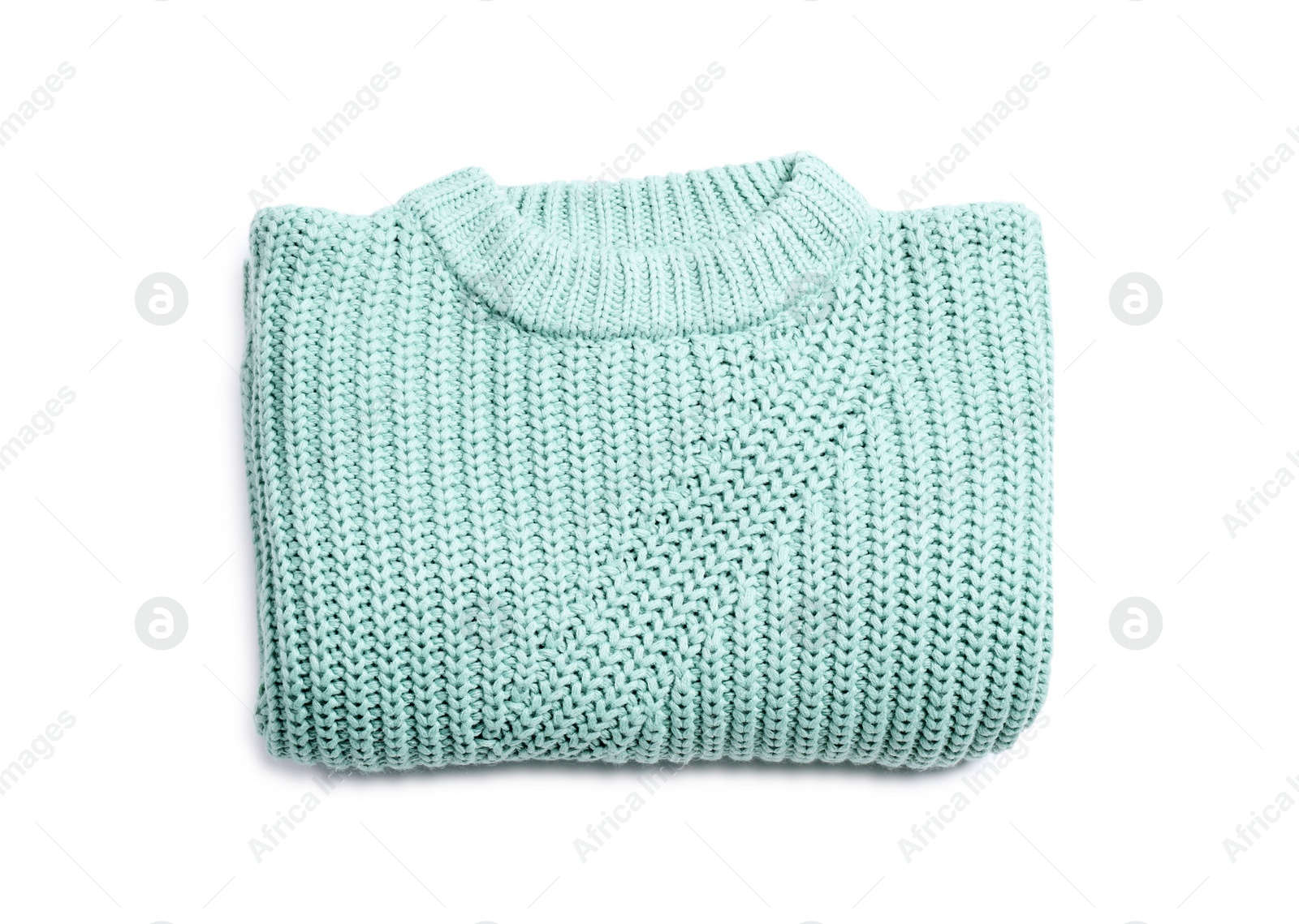 Photo of Folded knitted sweater on white background, top view