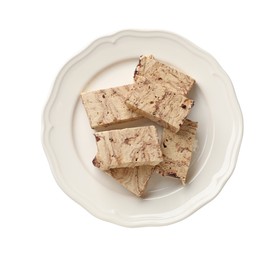 Photo of Pieces of tasty chocolate halva isolated on white, top view