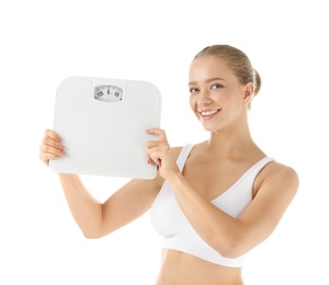 Beautiful young woman with scales on white background. Healthy diet