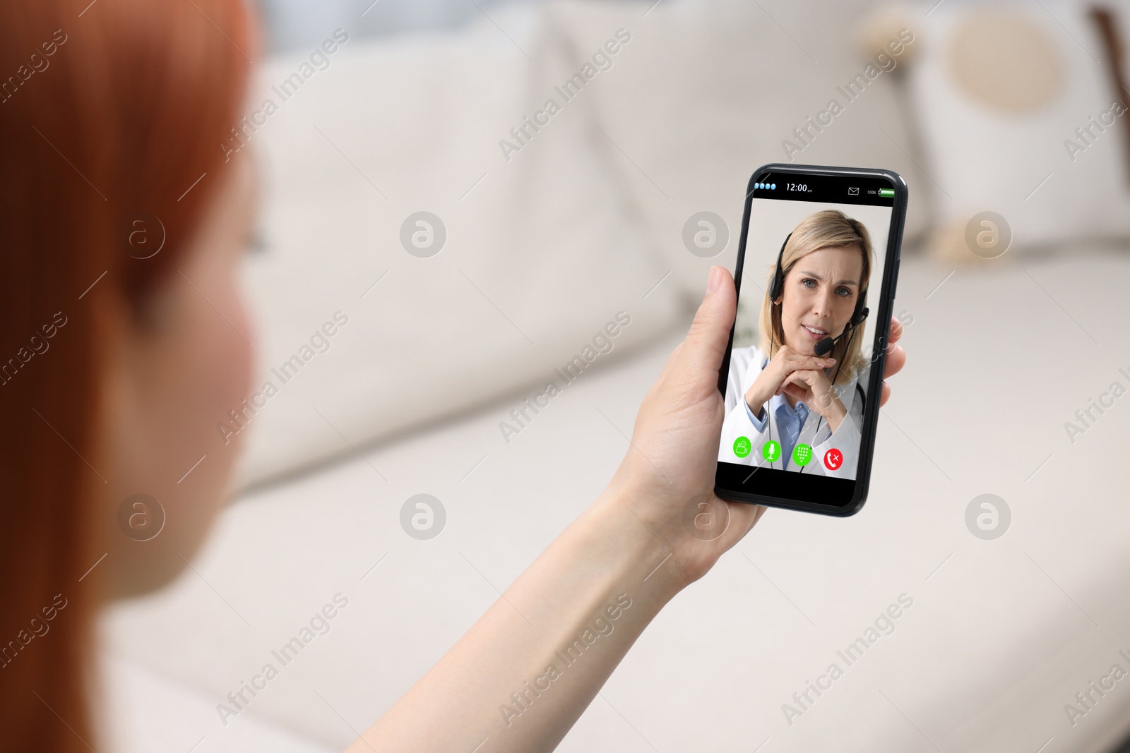 Image of Online medical consultation. Woman having video chat with doctor via smartphone at home, closeup