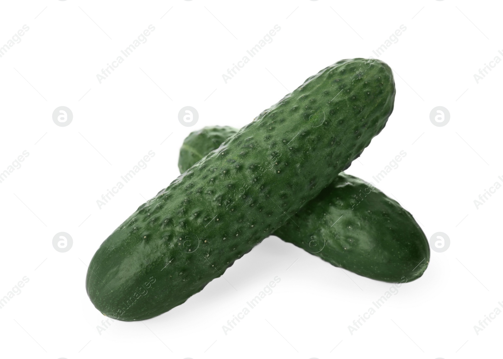 Photo of Whole fresh green cucumbers on white background