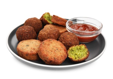 Plate with delicious vegan cutlets, falafel balls and sauce isolated on white