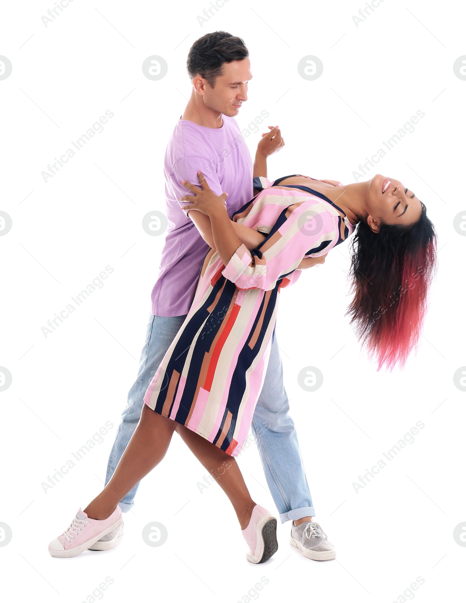 Photo of Beautiful lovely couple dancing on white background