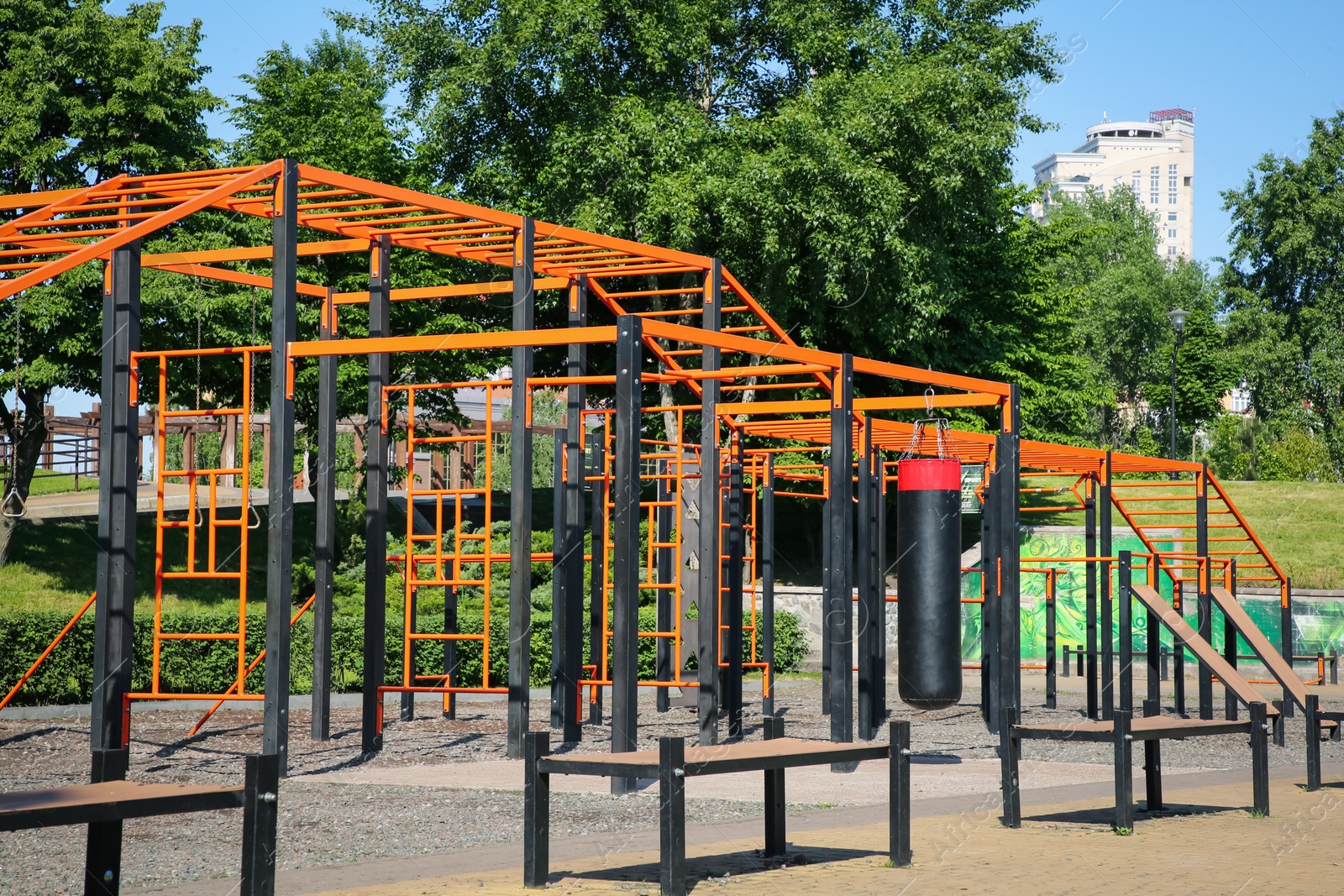 Photo of Empty outdoor gym with exercise equipment in park