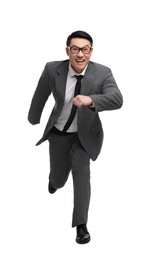 Businessman in suit running on white background