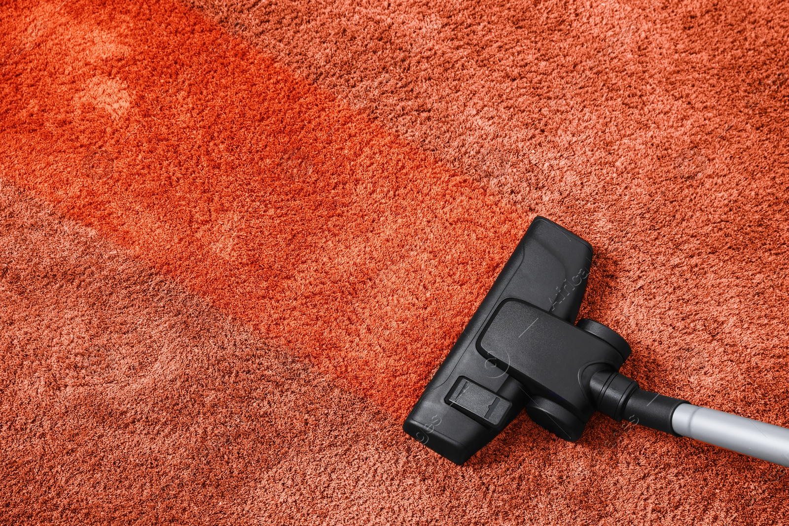 Image of Vacuuming carpet. Clean area after using device, top view