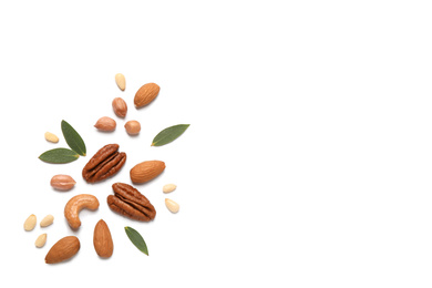 Different delicious nuts on white background, flat lay. Space for text