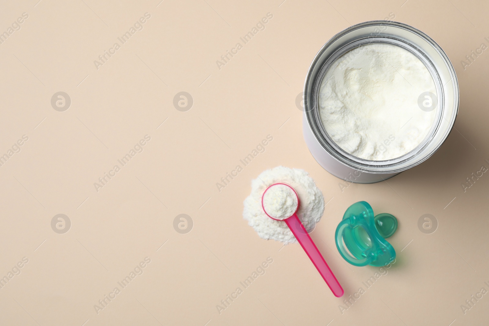 Photo of Flat lay composition with powdered infant formula on beige background, space for text. Baby milk