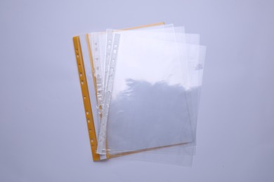 Photo of File folder with punched pockets isolated on white, top view